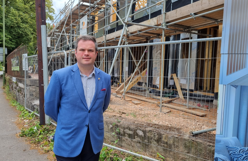 Kevin Foster with new homes being built in the background.