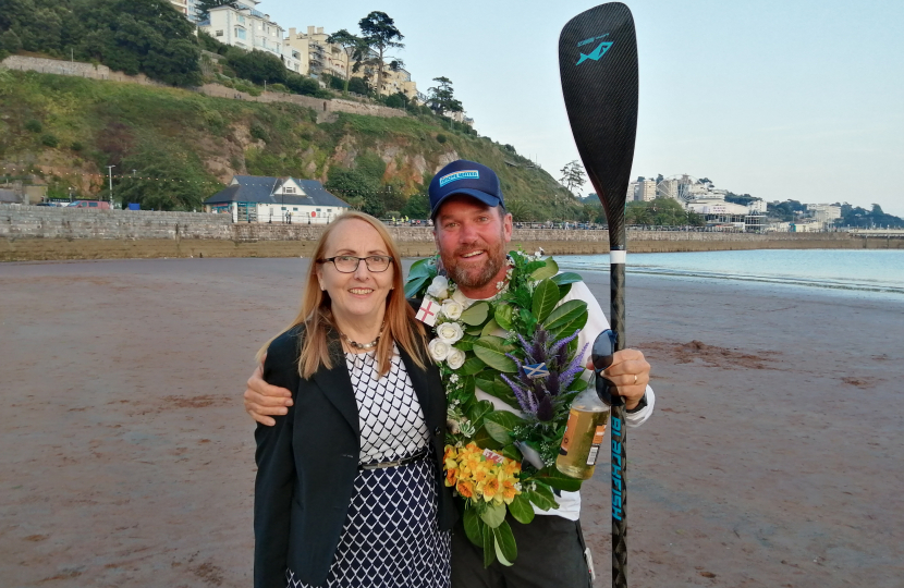 Cllr Hazel Foster welcoming Brendon Prince back to Torquay at the end of his epic journey