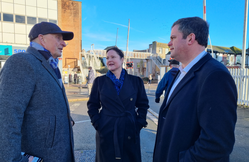 Alison Hernandez and Kevin Foster MP talking with a resident in Station Square, Paignton.