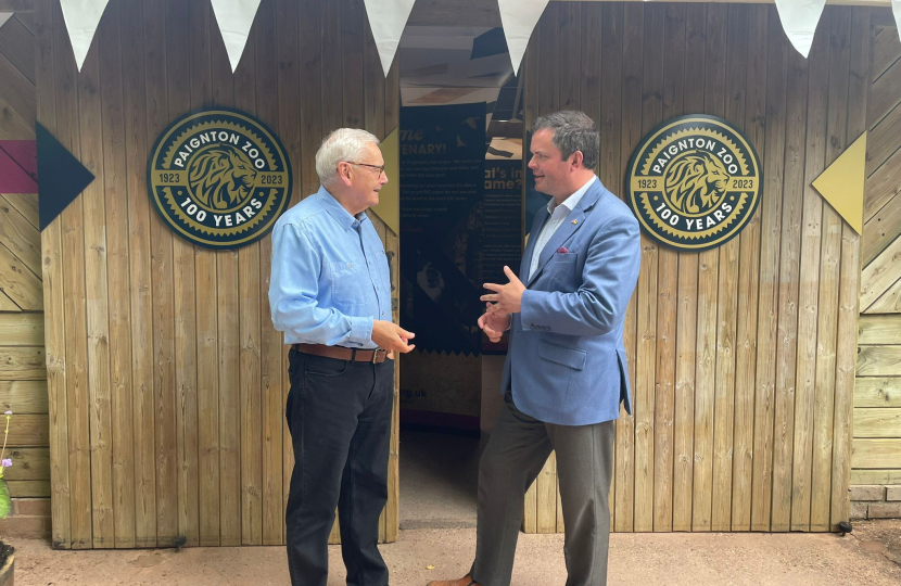 Wild Planet Trust CEO Dennis Flynn talks with Kevin Foster MP at the Zoo's Centenary Exhibiton.