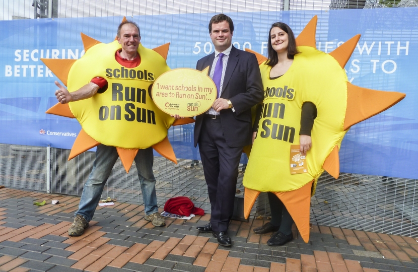 Kevin Foster poses with giant suns.