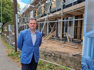 Kevin Foster with new homes being built in the background.