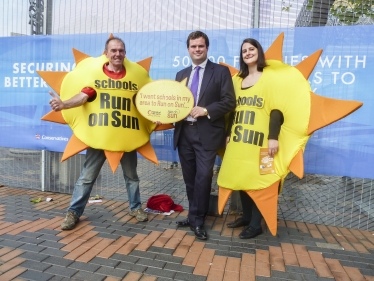 Kevin Foster poses with giant suns.